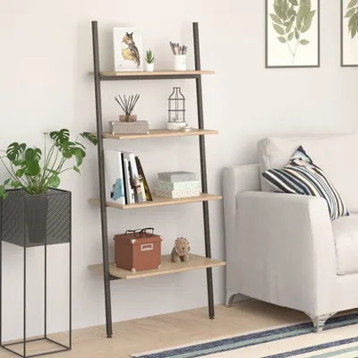 A ladder shelf with decorative items next to a sofa.