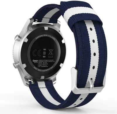 The back of a smartwatch with a striped nylon band.