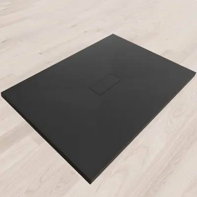 A black shower tray on a light wood-effect floor.