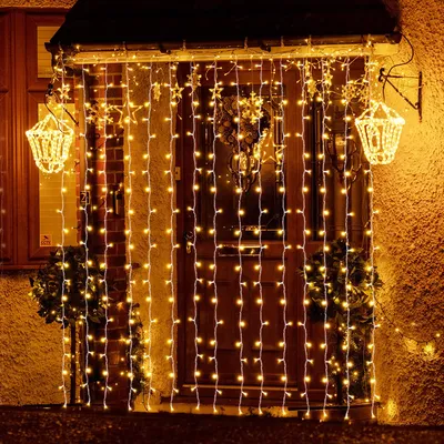 A decorated doorway with string lights for Christmas.