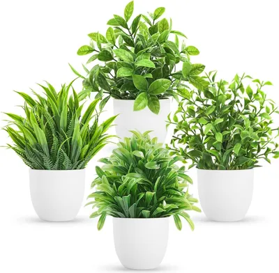 Four artificial potted plants arranged on a white background.