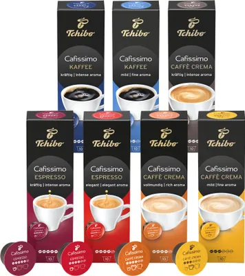 A collection of Tchibo Cafissimo coffee capsule boxes and loose capsules.