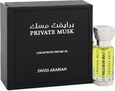 A black box and a small bottle of perfume are shown against a white background.