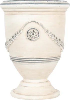 A beige ceramic pot with decorative elements.