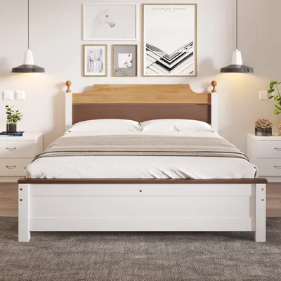 A bedroom scene with a bed, nightstands, and artwork on the wall.