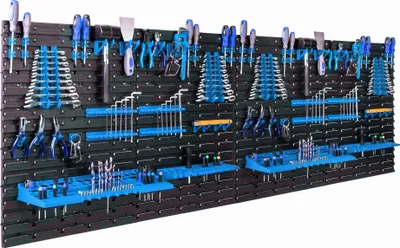 A wall-mounted tool organizer filled with various tools.