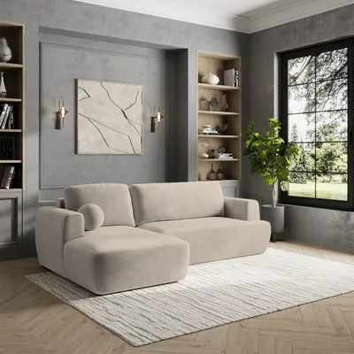 A modern living room with a sectional sofa, bookshelves, and a large window.