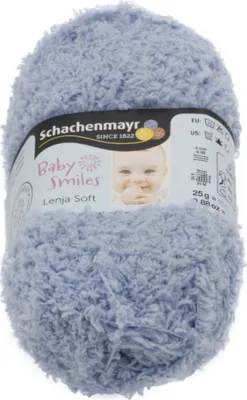A ball of light blue, fuzzy yarn with a label showing a baby and brand information.