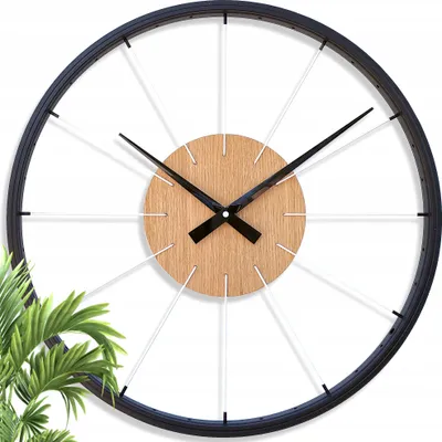 A modern wall clock with a bicycle wheel design.