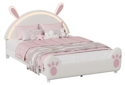 Immagine prodotto di Letto a una piazza e mezza Moonbite a forma di coniglio, dimensioni 140x200 cm, con luci LED e decorazioni a forma di orecchie, colore bianco e rosa, con illuminazione d'ambiente