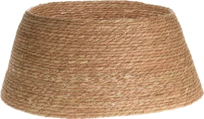 A conical tree skirt made of woven natural material.