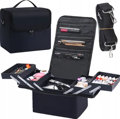 A black makeup case with its compartments open, displaying various makeup items and brushes, along with a separate closed case and a shoulder strap.