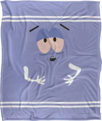 A close-up, flat lay image of a purple blanket with a cartoon face printed on it.