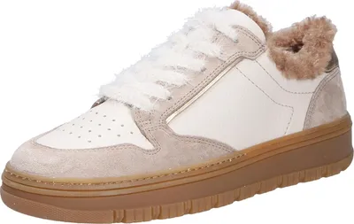 A single beige sneaker with white laces and brown sole is shown against a white background.