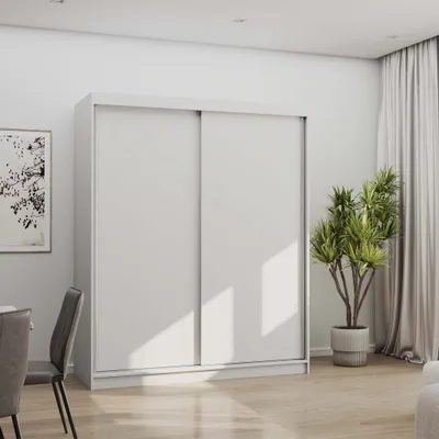 A white sliding door wardrobe is shown in a well-lit room with a plant and curtains in the background.