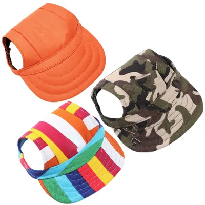 Three dog caps with ear holes are displayed against a white background.