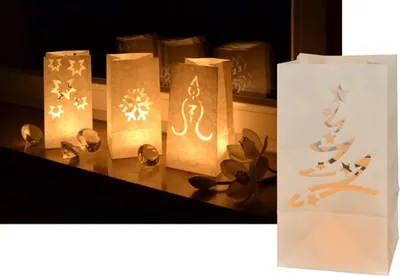 A collage of Christmas-themed paper lanterns with cut-out designs, some lit from within, and a separate lantern with a Christmas tree design.