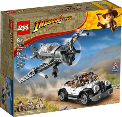 The image shows the box of a LEGO Indiana Jones playset, featuring a fighter plane and a vehicle.