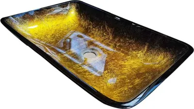 A rectangular glass sink with a gold and black textured pattern.