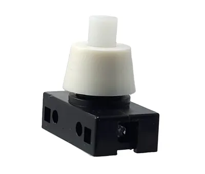A product shot of a white and black push button switch on a white background.