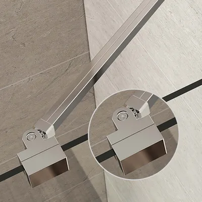 A close-up view of a metal shower support bar hinge mechanism attached to a shower wall.