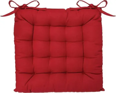 A red square seat cushion with ties on a white background.