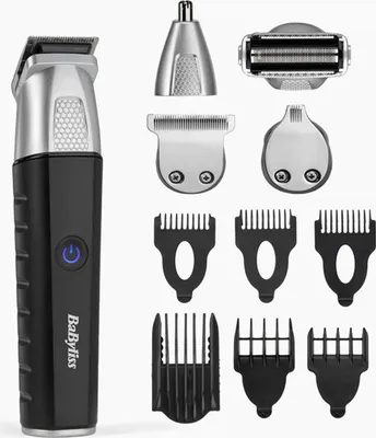 A collection of grooming tools, including a trimmer and various attachments, laid out against a white background.