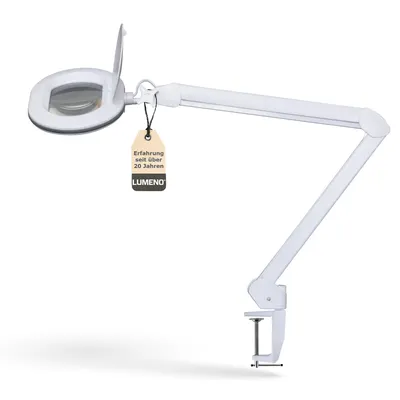 A white magnifying lamp with an adjustable arm and clamp base, shown against a white background. A tag with text is attached to the lamp.