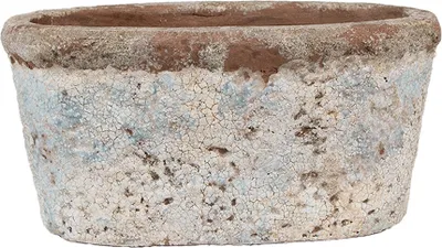 A close-up, front-facing studio shot of an oval-shaped terracotta planter with a distressed beige and blue crackle glaze.