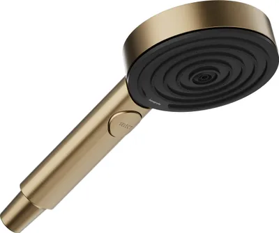 A close-up, angled view of a gold and black shower head against a white background.