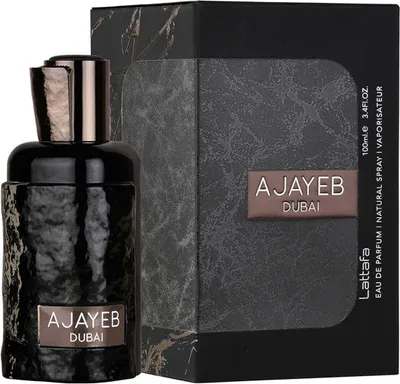 A black bottle of Lattafa Ajayeb Dubai Eau de Parfum and its packaging are displayed against a white background.