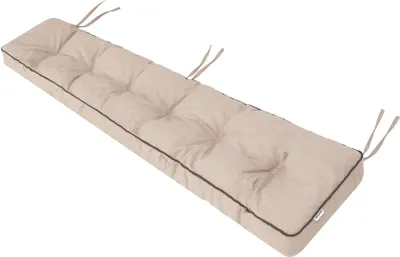 A long, tufted bench cushion with ties, presented on a white background.