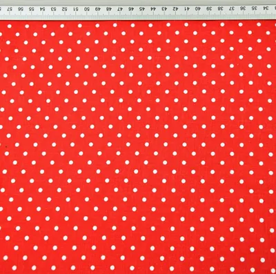 Produktbild von 100% Baumwolle Punkte 4mm weiß auf rotem Hintergrund