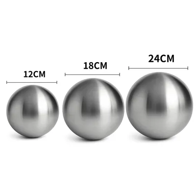 Three stainless steel spheres of different sizes are displayed side-by-side, with their diameters indicated by text labels.