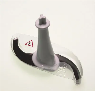 A close-up studio shot of a food processor blade attachment on a white background.