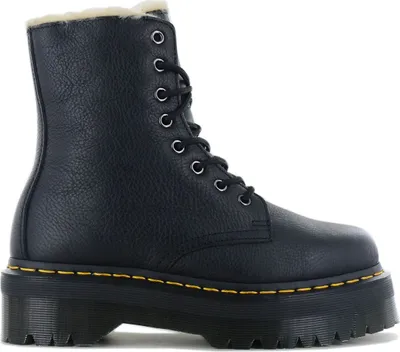 A black Dr. Martens boot with a platform sole and faux fur lining, shown from a side angle against a white background.