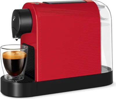 A red Tchibo Cafissimo coffee machine with a glass of espresso.