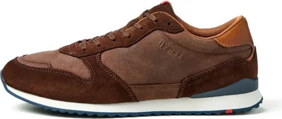 A side view of a brown athletic shoe.