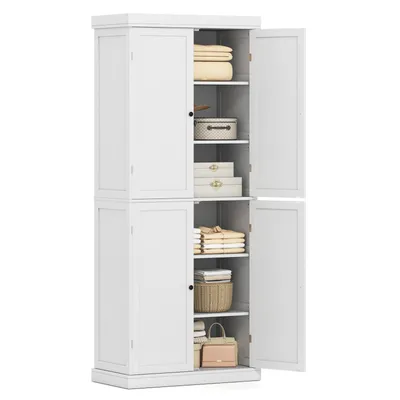 A white four-door storage cabinet with its doors open, revealing shelves stocked with folded towels, boxes, and baskets.