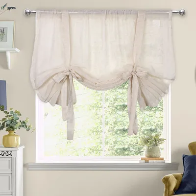 A tie-up shade window covering in a room.