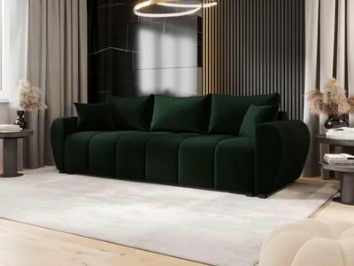 A dark green velvet sofa is positioned in a modern living room.