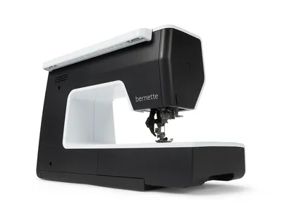 A black and white sewing machine is shown against a white background.