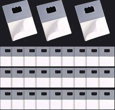 Immagine prodotto di 30 ganci autoadesivi in plastica per foto e poster