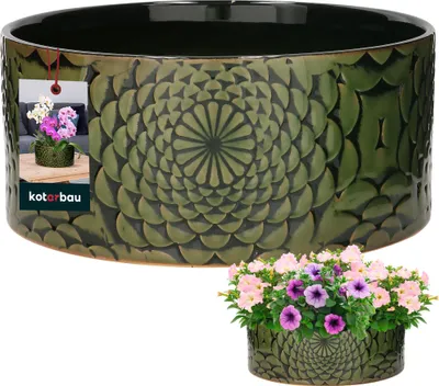 A green ceramic planter with a decorative pattern, shown with flowers in a separate inset image.