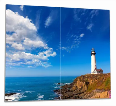 Produktbild von Wallario Herdabdeckplatte aus Glas, Größe 60 x 52 cm 2-teilig, Motiv Leuchtturm auf einem Felsvorsprung - Blauer Himmel