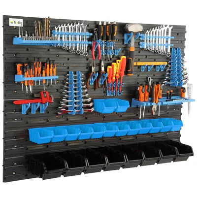 A wall-mounted tool organizer filled with various tools.