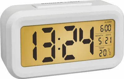 A digital alarm clock displaying the time, date, alarm time, and temperature.