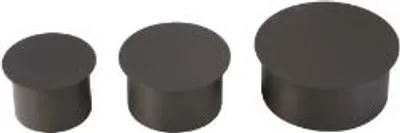 Three dark gray cylindrical objects of varying heights are arranged in a row on a white background.