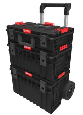 A stack of three black toolboxes with red accents and a retractable handle, resting on wheels.