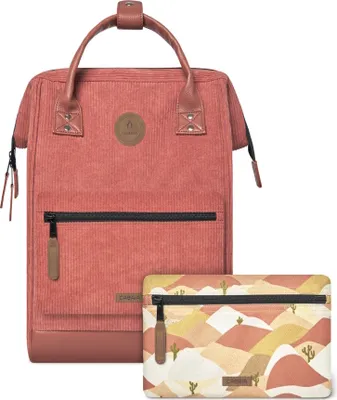 A red corduroy backpack and a patterned pouch are displayed against a white background.